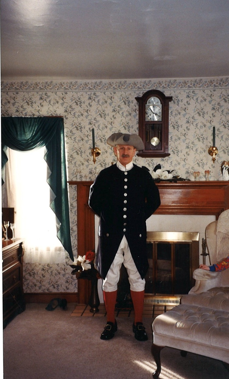 Man in a Revolutionary War outfit standing in a Federalist living room